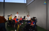 Discours d'encouragement du coach à ses joueurs de footfauteuil